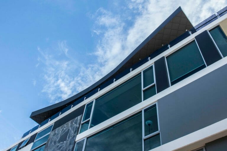 Bridge Road Apartments features Standing Seam and Shingles by Metal