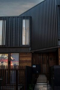 Nailstrip cladding in COLORBOND® Monument® at Charlotte Place Townhouses, Melbourne