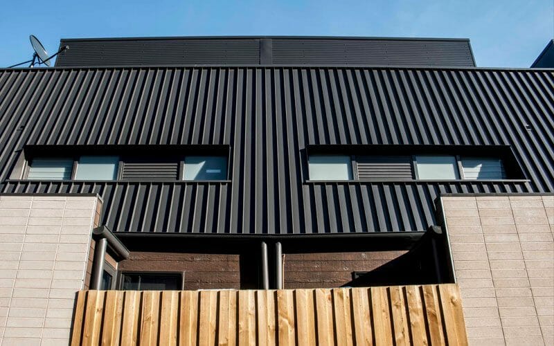 Nailstrip cladding in COLORBOND® Monument® at Charlotte Place Townhouses, Melbourne